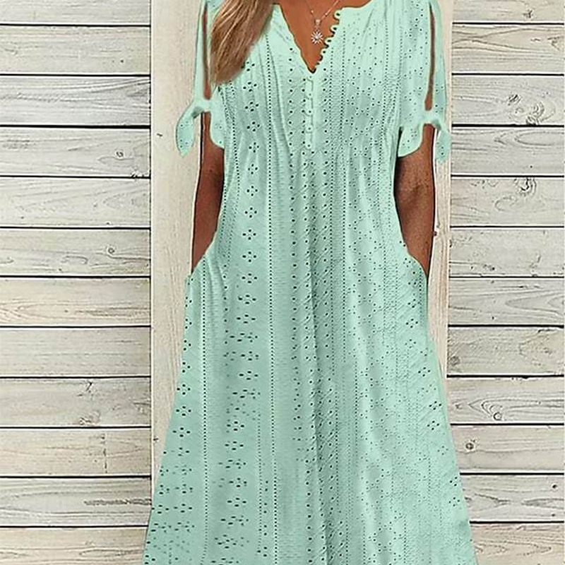 Elegantes Kleid mit V-Ausschnitt und durchbrochenen Details